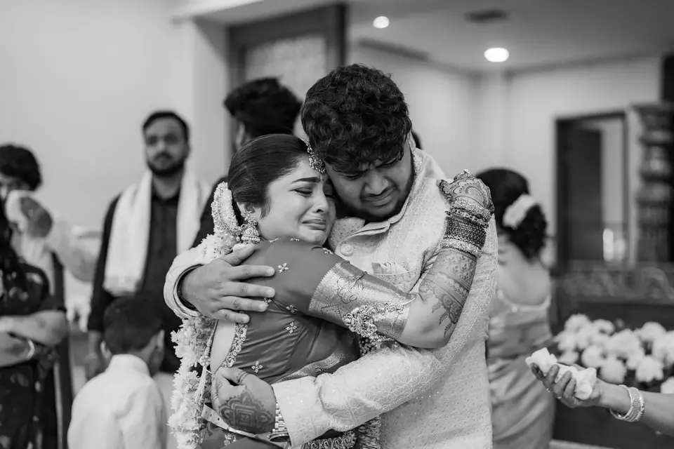 Black and white: the bride and groom holding each other tightly as the day ends