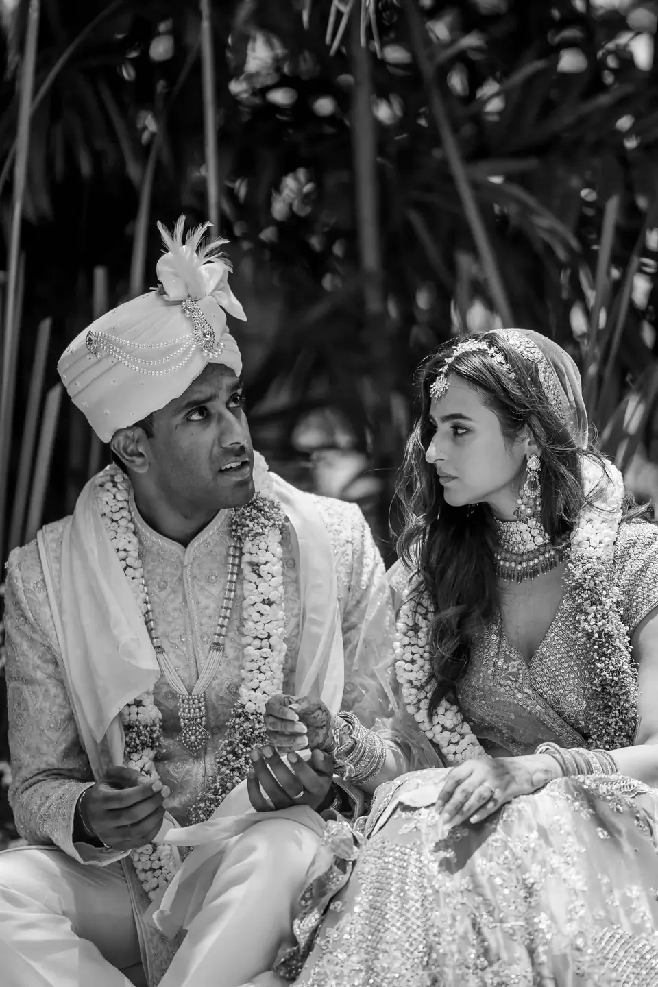 Black and white: the couple seated side by side during the rites