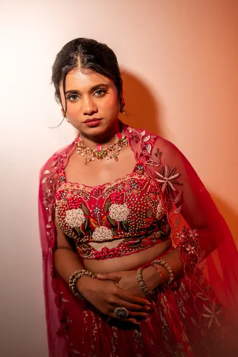 Sahana in a rose-pink lehenga in warm light